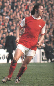 Charlie George in an Arsenal shirt
