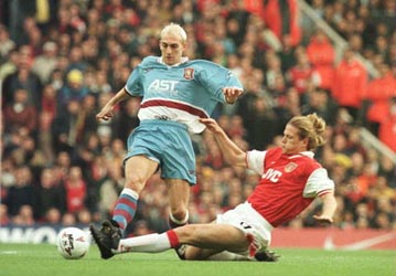 Emmanuel Petit making a tackle for Arsenal